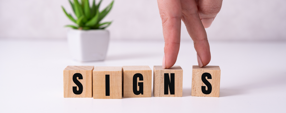 the word signs spelled out in blocks