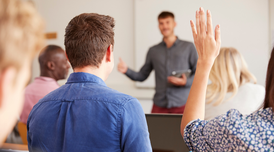 meeting with hand raised